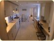 Limestone floor, inset lighting, breakfast bar